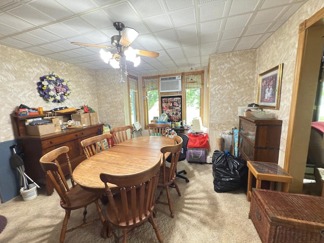 107 3rd Ave, Bellingham, MN 56212 - carpeted dining space with ceiling fan, wallpapered walls, and a wall mounted AC
