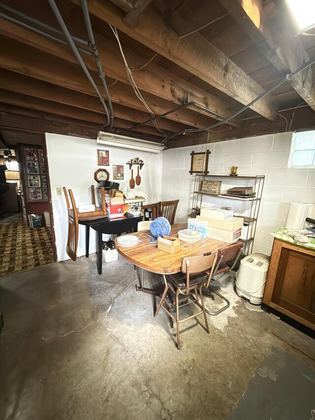107 3rd Ave, Bellingham, MN 56212 - dining area featuring unfinished concrete flooring and concrete block wall