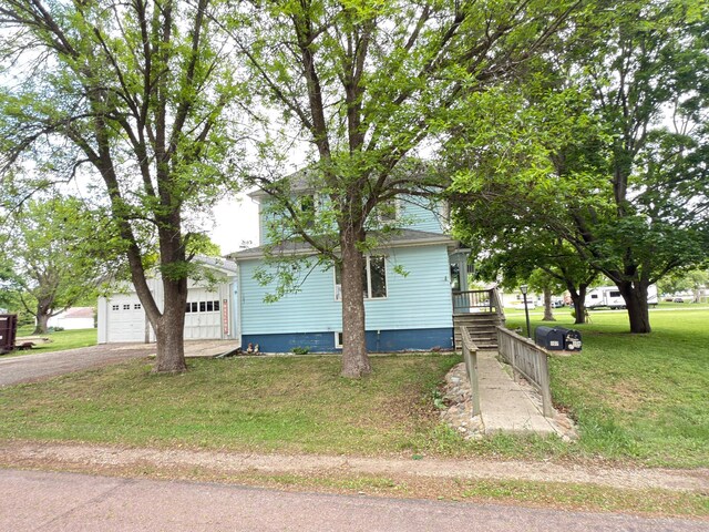 107 3rd Ave, Bellingham, MN 56212 - view of front of property with a front yard, a garage, and driveway