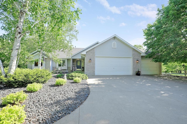 2301 170th Ln NW, Andover, MN 55304 - single story home featuring brick siding, an attached garage, and driveway