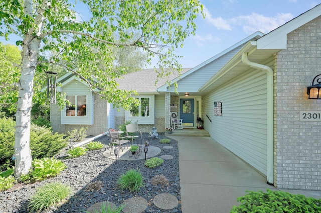 2301 170th Ln NW, Andover, MN 55304 - entrance to property featuring brick siding and a patio