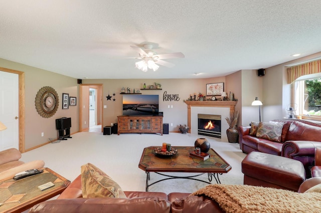 2301 170th Ln NW, Andover, MN 55304 - carpeted living area featuring ceiling fan, a glass covered fireplace, and a textured ceiling