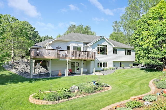 2301 170th Ln NW, Andover, MN 55304 - rear view of house featuring a wooden deck, a yard, and a patio area