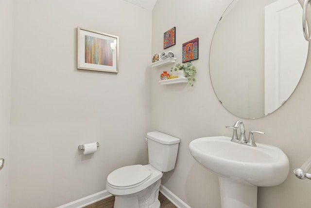 8094 Arrowwood Ln N, Maple Grove, MN 55369 - half bath featuring toilet, baseboards, wood finished floors, and a sink