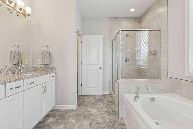 8094 Arrowwood Ln N, Maple Grove, MN 55369 - bathroom with vanity, a garden tub, a stall shower, and baseboards