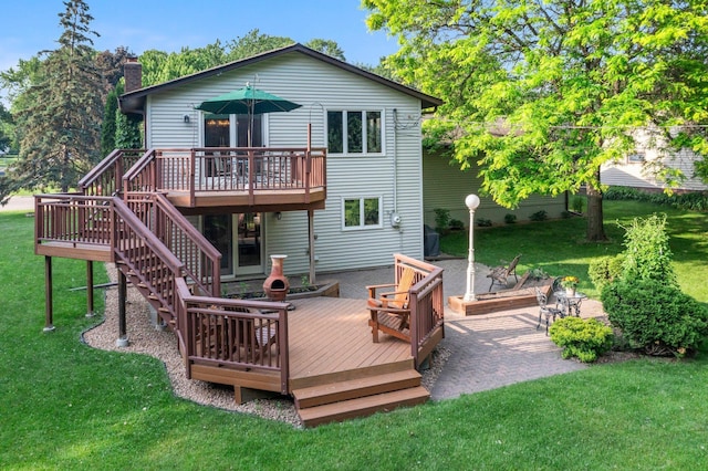 674 Mound Ave, Shoreview, MN 55126 - rear view of property featuring a deck, a chimney, a lawn, and stairs