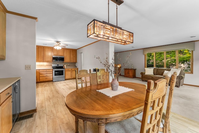 674 Mound Ave, Shoreview, MN 55126 - dining space featuring a ceiling fan, light wood finished floors, and ornamental molding