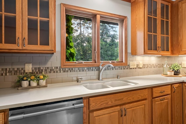 674 Mound Ave, Shoreview, MN 55126 - kitchen with stainless steel dishwasher, light countertops, and backsplash