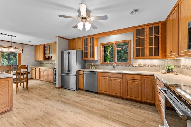 674 Mound Ave, Shoreview, MN 55126 - kitchen with stainless steel appliances, tasteful backsplash, glass insert cabinets, and healthy amount of natural light