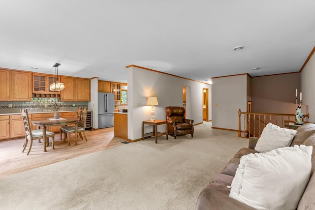 674 Mound Ave, Shoreview, MN 55126 - living area featuring ornamental molding, light carpet, and wine cooler