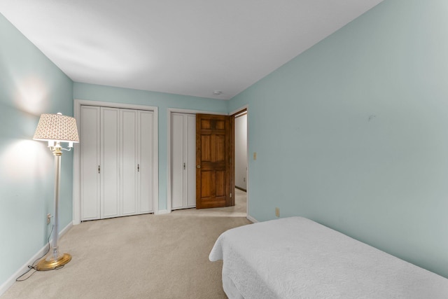 674 Mound Ave, Shoreview, MN 55126 - carpeted bedroom with two closets and baseboards