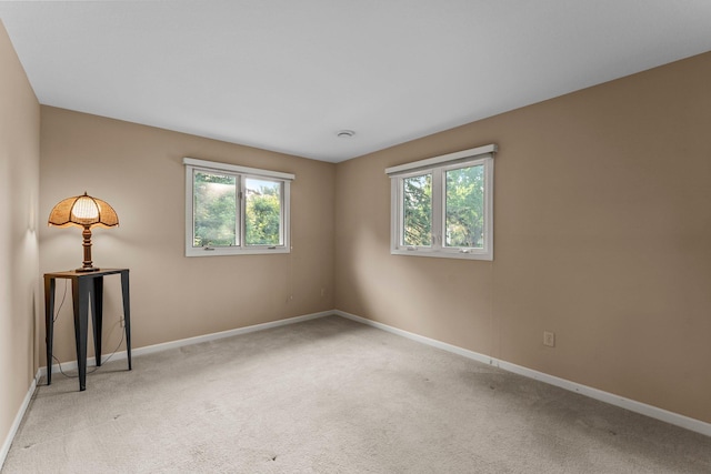 674 Mound Ave, Shoreview, MN 55126 - empty room with healthy amount of natural light and light colored carpet