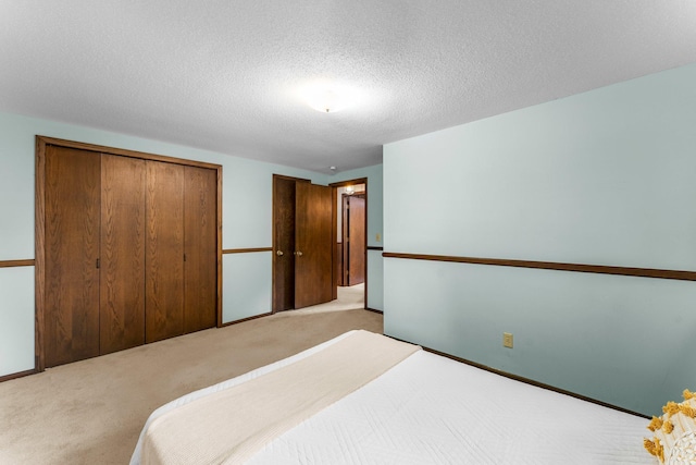 674 Mound Ave, Shoreview, MN 55126 - carpeted bedroom with a closet and a textured ceiling