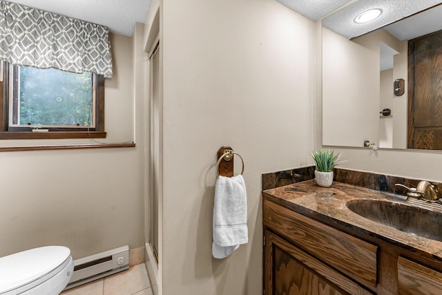 674 Mound Ave, Shoreview, MN 55126 - full bath with a textured ceiling, a baseboard heating unit, vanity, tile patterned floors, and a shower stall