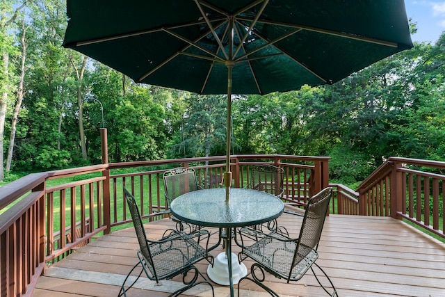674 Mound Ave, Shoreview, MN 55126 - wooden terrace with outdoor dining area and a lawn