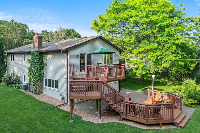 674 Mound Ave, Shoreview, MN 55126 - back of house featuring a deck, a chimney, a yard, and stairway