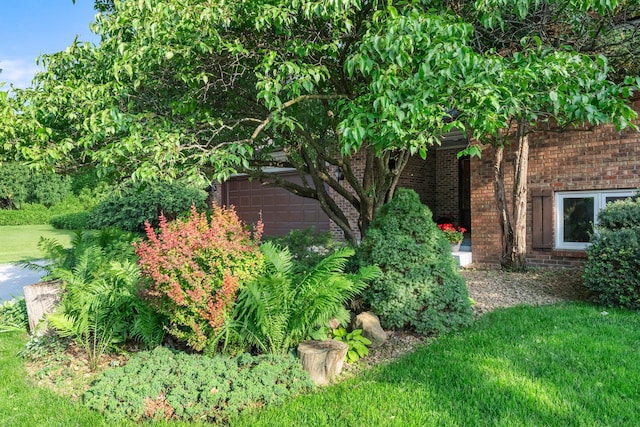 674 Mound Ave, Shoreview, MN 55126 - view of home's exterior featuring brick siding and a yard