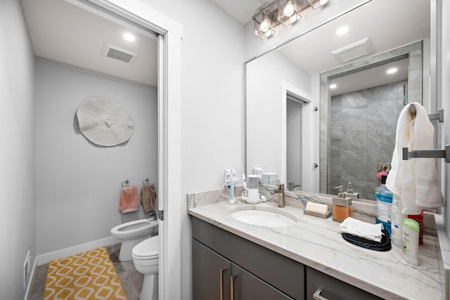 27755 Island View Rd, Shorewood, MN 55331 - bathroom featuring a bidet, vanity, toilet, recessed lighting, and a tile shower