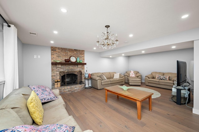 27755 Island View Rd, Shorewood, MN 55331 - living room featuring wood finished floors, recessed lighting, and a brick fireplace