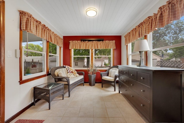 3243 Cleveland St NE, Minneapolis, MN 55418 - living area with plenty of natural light, crown molding, light tile patterned floors, and baseboards