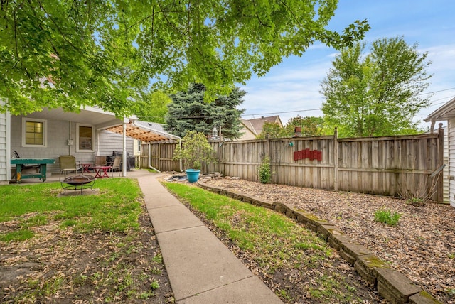 3243 Cleveland St NE, Minneapolis, MN 55418 - fenced backyard featuring an outdoor fire pit and a patio
