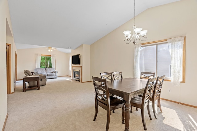 940 105th Ave NW, Coon Rapids, MN 55433 - dining room featuring vaulted ceiling, light colored carpet, a fireplace with flush hearth, a chandelier, and baseboards