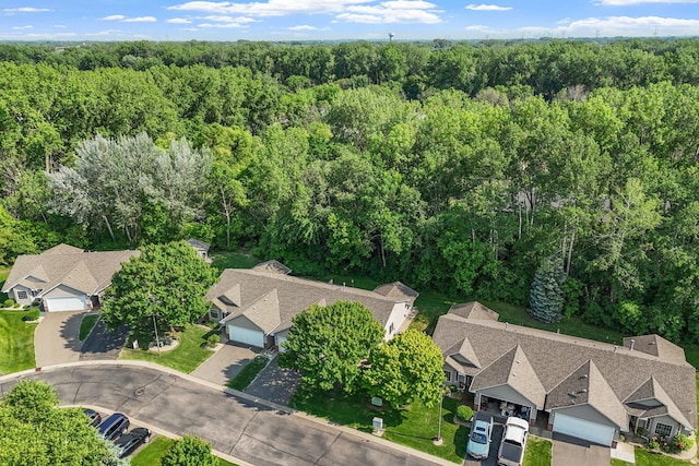 940 105th Ave NW, Coon Rapids, MN 55433 - aerial overview of property's location featuring a heavily wooded area