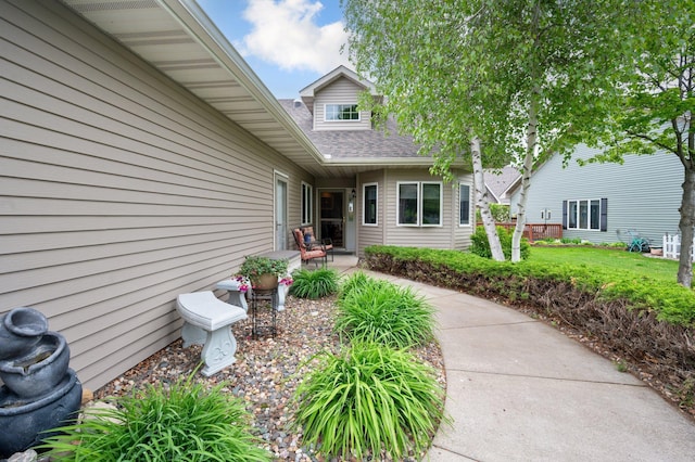145 Bluebird Ln, Clearwater, MN 55320 - doorway to property with a shingled roof and a patio area