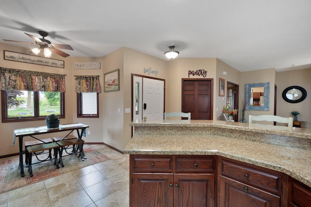 145 Bluebird Ln, Clearwater, MN 55320 - kitchen with light countertops, ceiling fan, baseboards, and light tile patterned flooring
