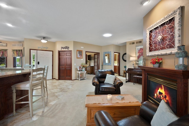 145 Bluebird Ln, Clearwater, MN 55320 - living room featuring a glass covered fireplace and light colored carpet