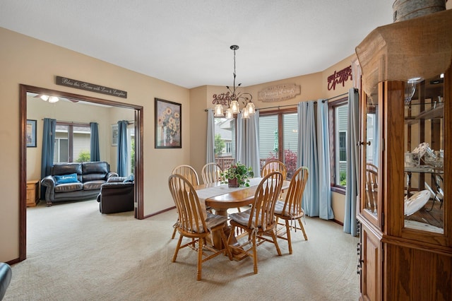 145 Bluebird Ln, Clearwater, MN 55320 - dining area with light carpet, a chandelier, and healthy amount of natural light