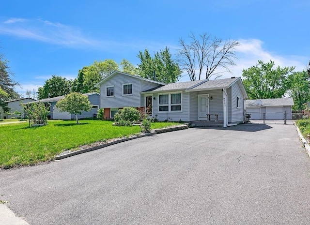 9705 99th Ave N, Maple Grove, MN 55369 - split level home featuring a detached garage, an outdoor structure, and a front lawn