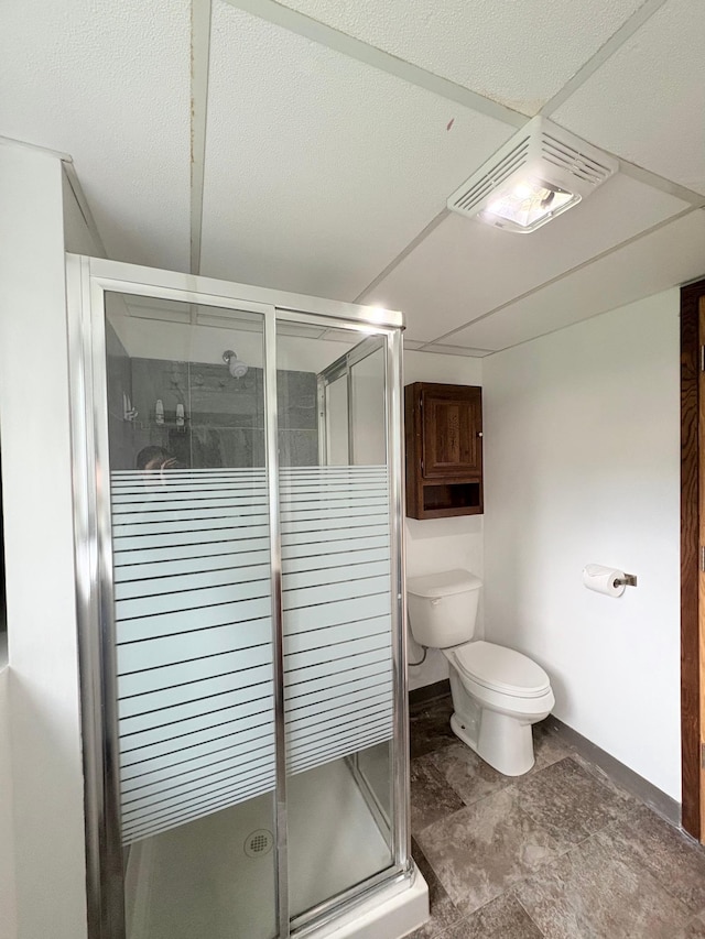 9705 99th Ave N, Maple Grove, MN 55369 - bathroom featuring toilet, a stall shower, and baseboards