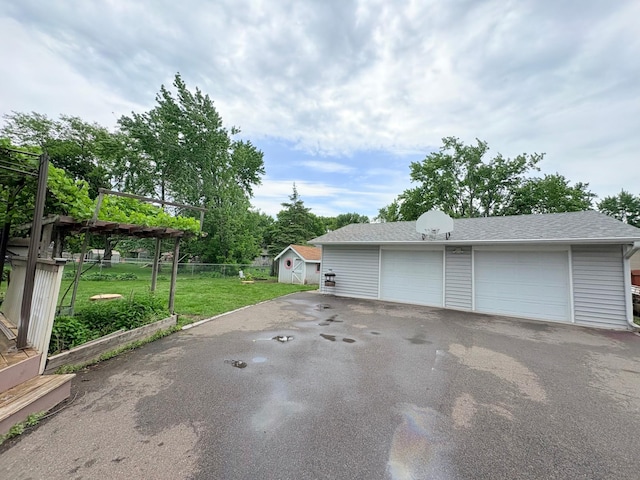 9705 99th Ave N, Maple Grove, MN 55369 - detached garage with a storage shed