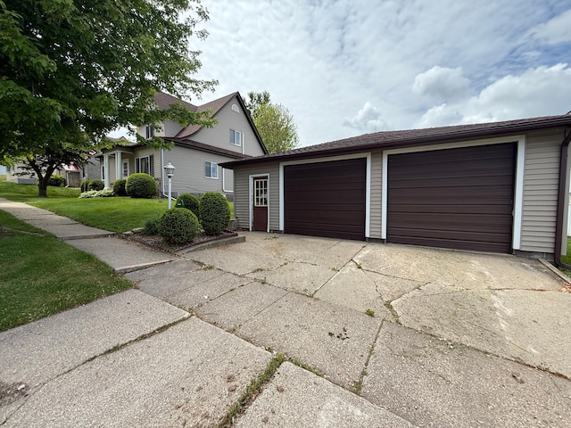 409 Maple St N, Mabel, MN 55954 - view of front of home with a garage, a front yard, and an outdoor structure
