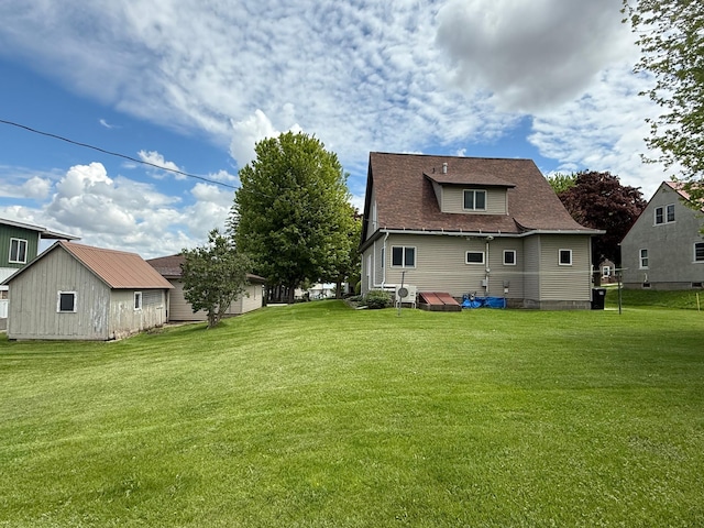 409 Maple St N, Mabel, MN 55954 - back of house with a lawn and a shingled roof