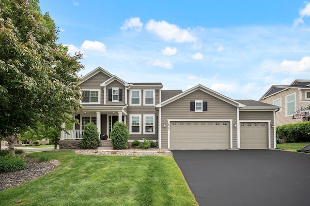 18301 100th Ave N, Osseo, MN 55311 - view of front facade featuring a porch, a front yard, driveway, and an attached garage