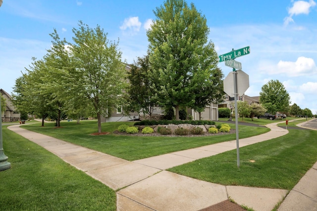 18301 100th Ave N, Osseo, MN 55311 - view of home's community with a yard