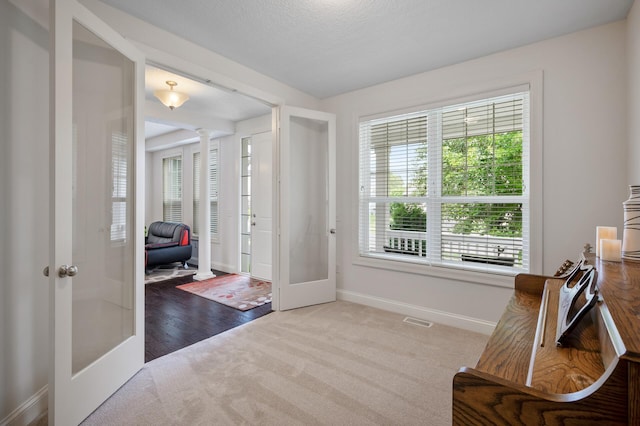 18301 100th Ave N, Osseo, MN 55311 - carpeted entryway featuring french doors, ornate columns, and baseboards