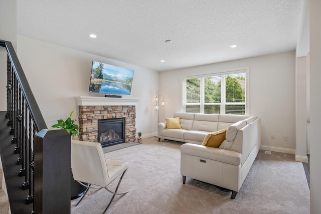 18301 100th Ave N, Osseo, MN 55311 - carpeted living area featuring a textured ceiling, recessed lighting, baseboards, stairway, and a fireplace
