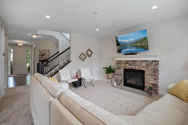 18301 100th Ave N, Osseo, MN 55311 - carpeted living room featuring baseboards, stairs, recessed lighting, and a fireplace