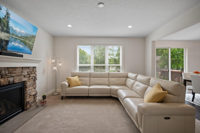 18301 100th Ave N, Osseo, MN 55311 - carpeted living area with plenty of natural light, recessed lighting, a fireplace, a textured ceiling, and baseboards
