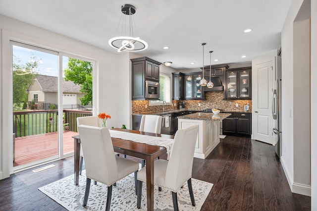 18301 100th Ave N, Osseo, MN 55311 - dining area with dark wood-type flooring, baseboards, and recessed lighting