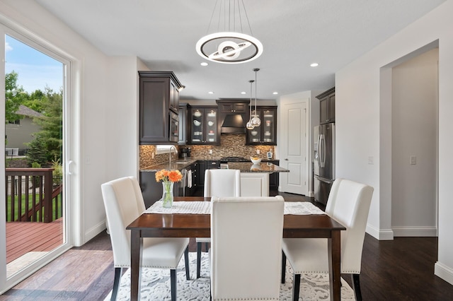 18301 100th Ave N, Osseo, MN 55311 - dining room featuring baseboards, dark wood-type flooring, a chandelier, and recessed lighting