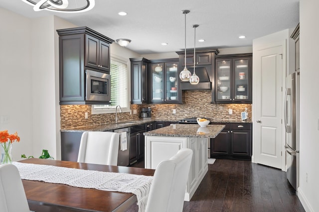 18301 100th Ave N, Osseo, MN 55311 - kitchen featuring stainless steel appliances, a sink, dark wood-style flooring, backsplash, and recessed lighting