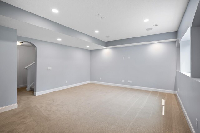 18301 100th Ave N, Osseo, MN 55311 - empty room featuring light carpet, arched walkways, recessed lighting, and baseboards