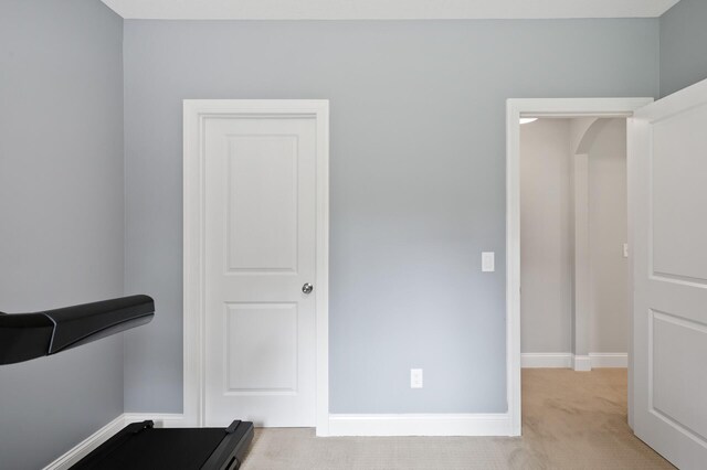 18301 100th Ave N, Osseo, MN 55311 - workout room featuring carpet flooring, arched walkways, and baseboards