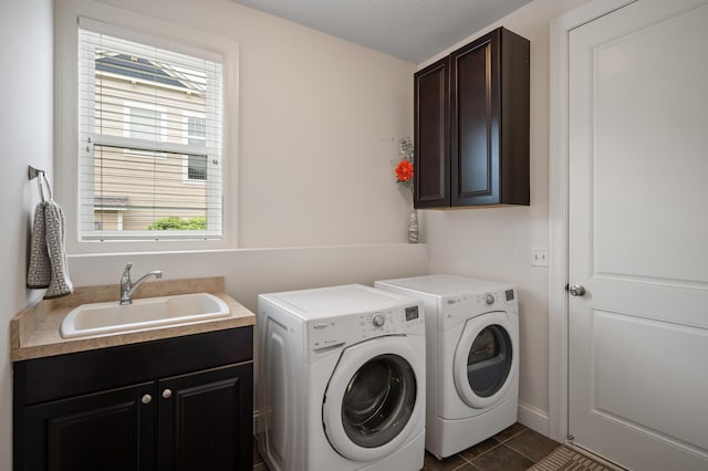 18301 100th Ave N, Osseo, MN 55311 - washroom with cabinet space, washing machine and dryer, and dark tile patterned flooring
