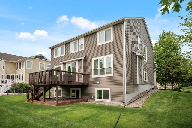 18301 100th Ave N, Osseo, MN 55311 - rear view of property with stairway, a wooden deck, and a lawn