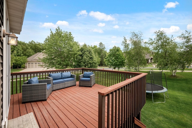 18301 100th Ave N, Osseo, MN 55311 - wooden deck featuring a trampoline, an outdoor living space, and a lawn